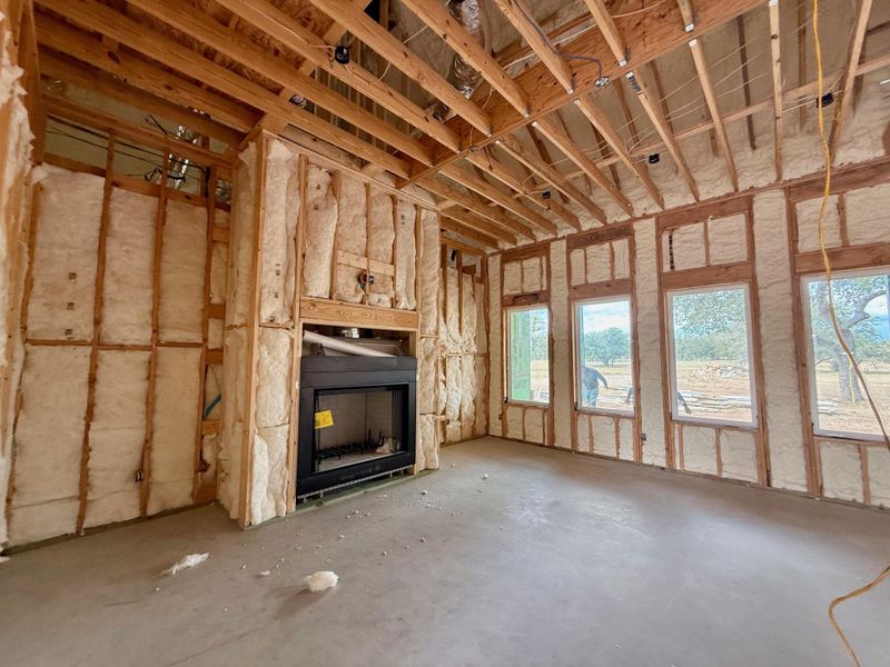 Bright open living with fireplace and high ceilings Bright open living with fireplace and high ceilings