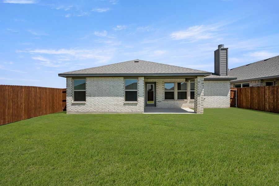 Representative exterior photo of a completed home built from the Austin by Impression Homes in Baker Farms, Cleburne, TX (Image 22).