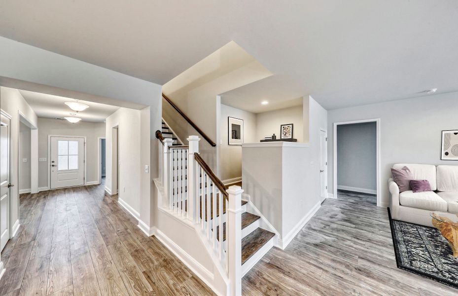 The Pulte Planning Center®  nestled off of the stairway while overseeing the large gathering room.