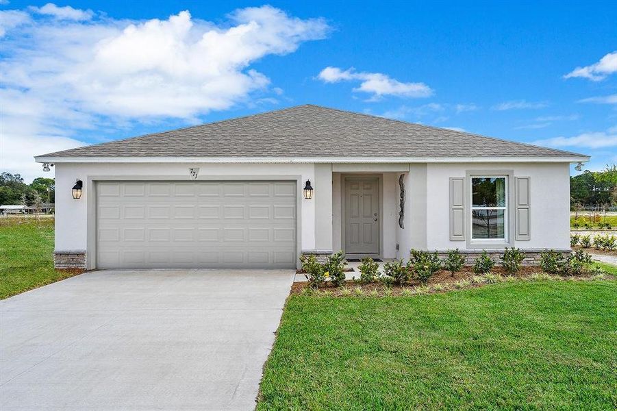 Front exterior of a new home in Poinciana, Poinciana, FL, highlighting curb appeal (Image 1).