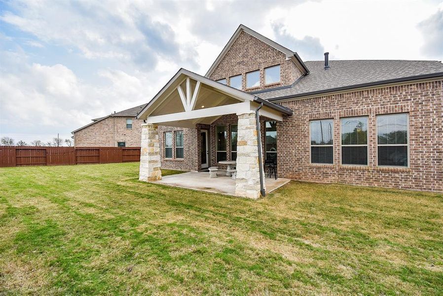 A large covered patio is perfect for outdoor entertaining, providing a sheltered space for gatherings, barbecues, or simply relaxing with family and friends. This area can be enhanced with comfortable seating, outdoor kitchens, and decorative elements to create an inviting atmosphere.