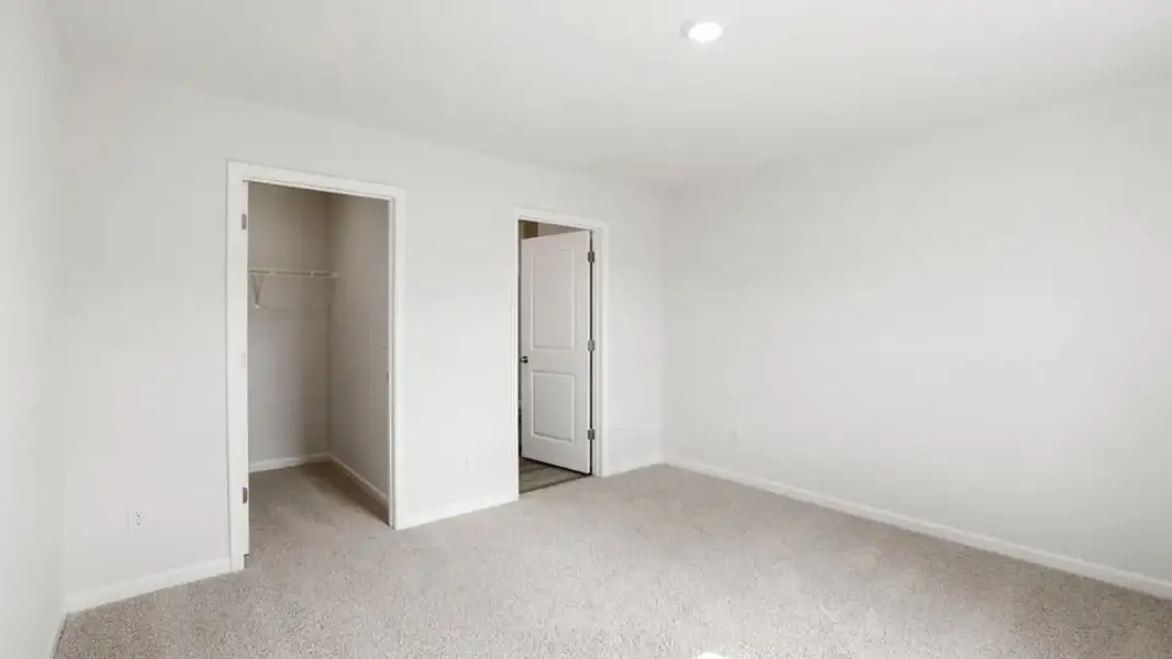 Spacious, unfurnished interior of a new home in Village Grove, Greenville (Image 28).