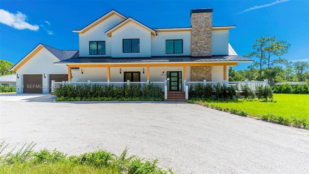 Front exterior of a new home in , Jupiter, FL, highlighting curb appeal (Image 1). Front exterior of a new home in , Jupiter, FL, highlighting curb appeal (Image 1).