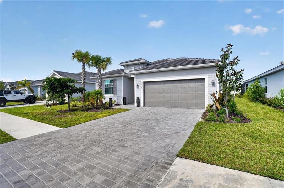 Front exterior of a new home in , Venice, FL, highlighting curb appeal (Image 23). Front exterior of a new home in , Venice, FL, highlighting curb appeal (Image 23).