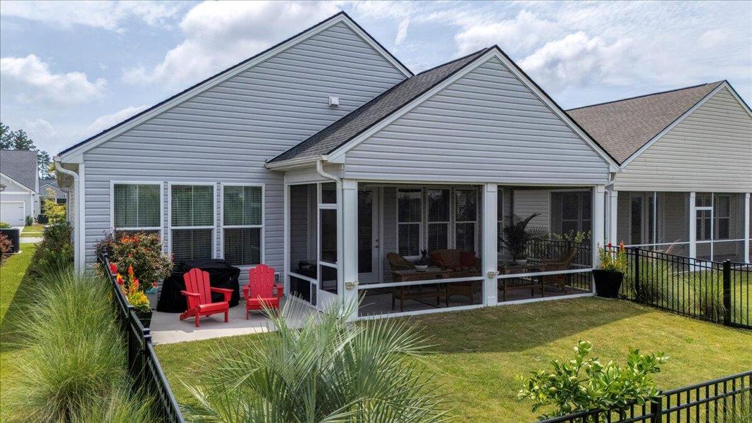 Front exterior of a new home in K. Hovnanian's® Four Seasons at Lakes of Cane Bay, Summerville, SC, highlighting curb appeal (Image 19).