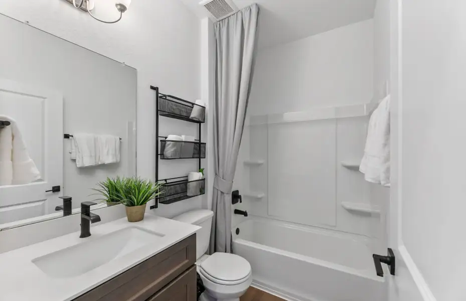 Furnished interior view inside a new home in Crosswinds, Kyle (Image 14).