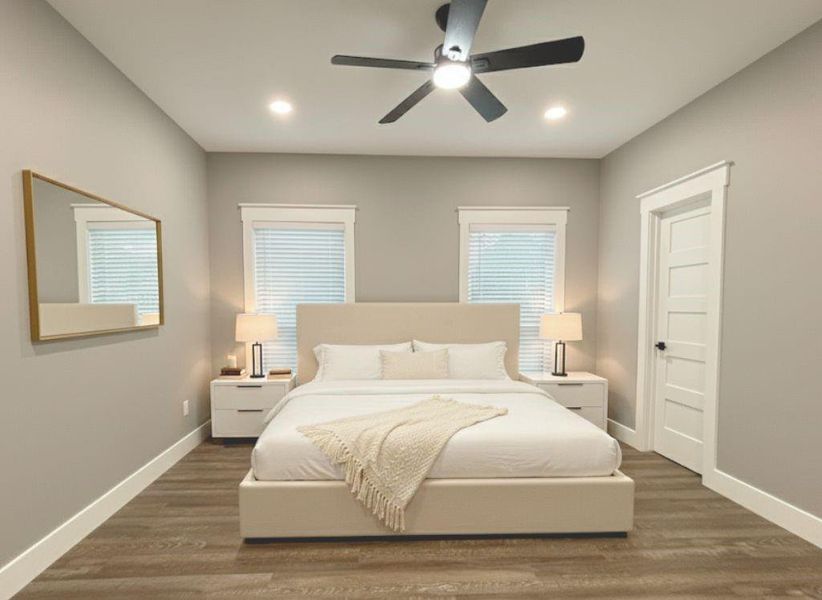 Bedroom with dark wood finished floors, ceiling fan, and recessed lighting Bedroom with dark wood finished floors, ceiling fan, and recessed lighting