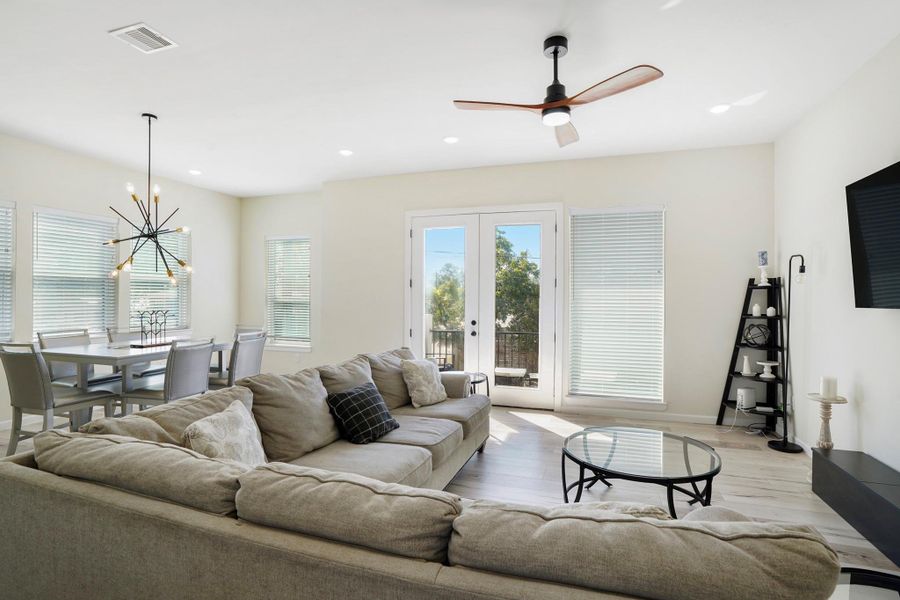 A balcony adds charm to the living/dining room.