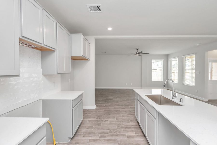 This generously spacious kitchen is a dream realized! Sample photo of completed home with similar floor plan. Actual colors and selections may vary.