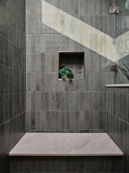Bathroom featuring tiled shower