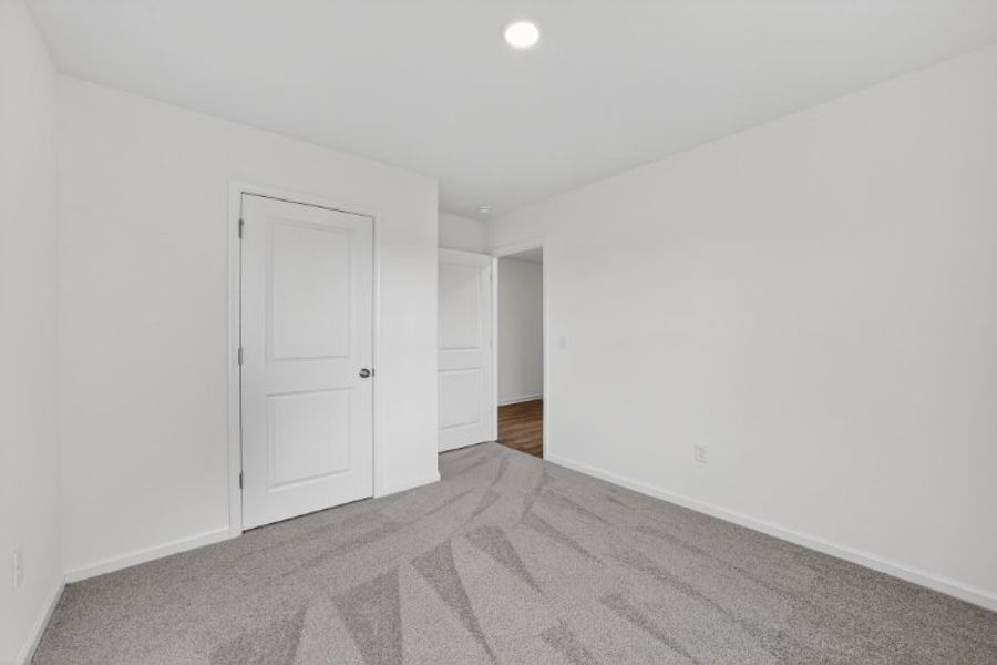 A hallway with white doors.