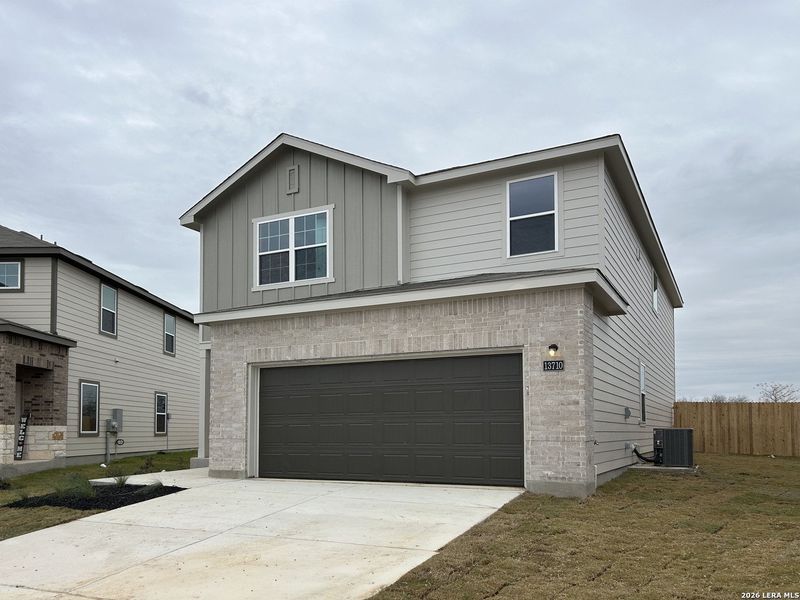 Front exterior of a new home in Meadows at Hennersby Hollow 40's, San Antonio, TX, highlighting curb appeal (Image 1). Front exterior of a new home in Meadows at Hennersby Hollow 40's, San Antonio, TX, highlighting curb appeal (Image 1).