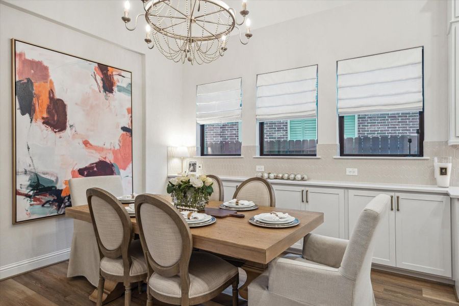 Custom roman shades and extended cabinetry for extra storage Custom roman shades and extended cabinetry for extra storage