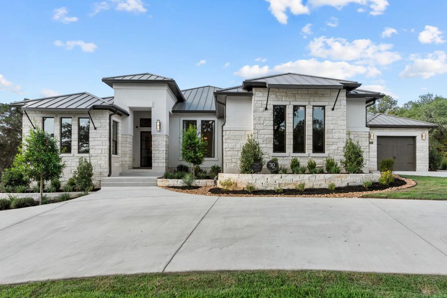 Front exterior of a home in the Shavano Highlands community, located in San Antonio, TX (Image 13).