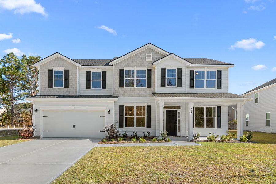 Front exterior of a new home in McAllister Pointe, Richmond Hill, GA, highlighting curb appeal (Image 1).