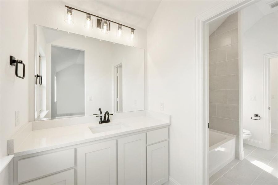 Furnished interior view inside a new home in Painted Tree Woodland District 50, McKinney (Image 13).