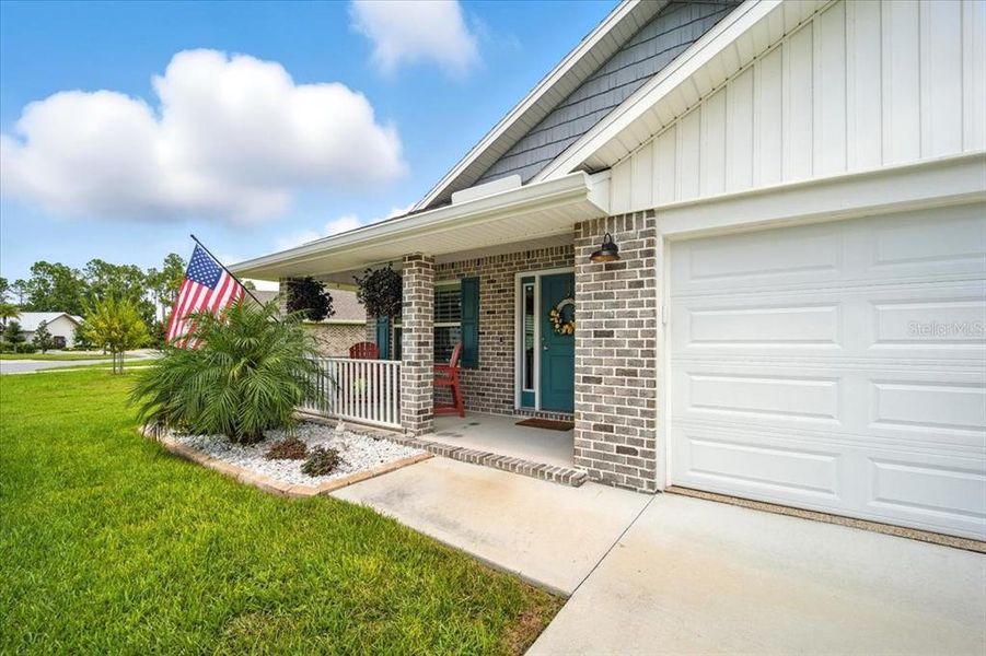 Front exterior of a new home in Sawmill Creek at Palm Coast Park, Palm Coast, FL, highlighting curb appeal (Image 18).