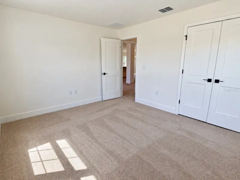 Spacious, unfurnished interior of a new home in Harmony Central, Harmony (Image 9).