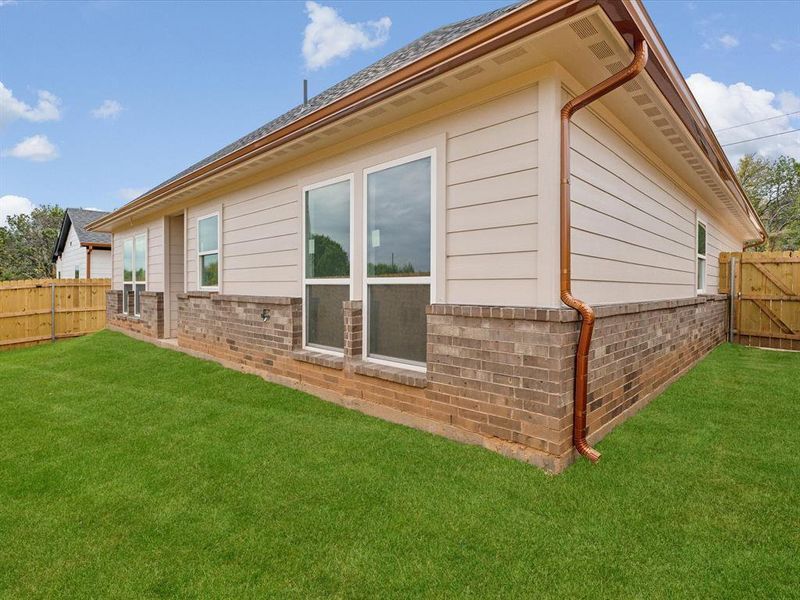 View of home's exterior with a lawn