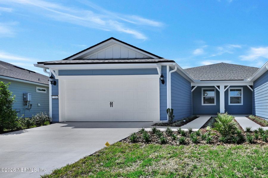 Front exterior of a new home in Del Webb Wildlight, Yulee, FL, highlighting curb appeal (Image 2). Front exterior of a new home in Del Webb Wildlight, Yulee, FL, highlighting curb appeal (Image 2).
