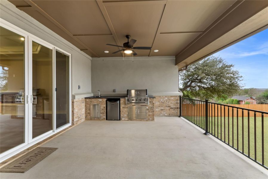 View of patio featuring ceiling fan and a sink View of patio featuring ceiling fan and a sink