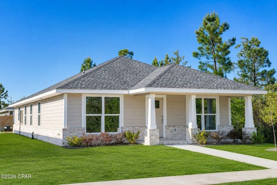 Front exterior of a new home in East Bay, Panama City, FL, highlighting curb appeal (Image 2). Front exterior of a new home in East Bay, Panama City, FL, highlighting curb appeal (Image 2).