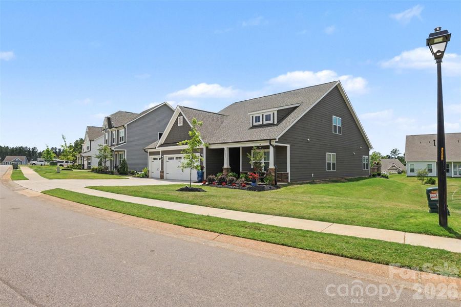 Front exterior of a new home in , Lancaster, SC, highlighting curb appeal (Image 21).