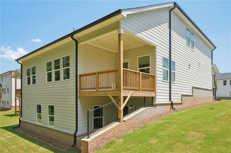 Front exterior of a new home in Martin Springs - Estate Series, Lawrenceville, GA, highlighting curb appeal (Image 2). Front exterior of a new home in Martin Springs - Estate Series, Lawrenceville, GA, highlighting curb appeal (Image 2).