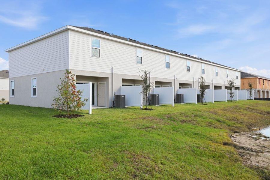 Exterior details and patio area of a home in The Towns at Firethorn, Parrish (Image 20).