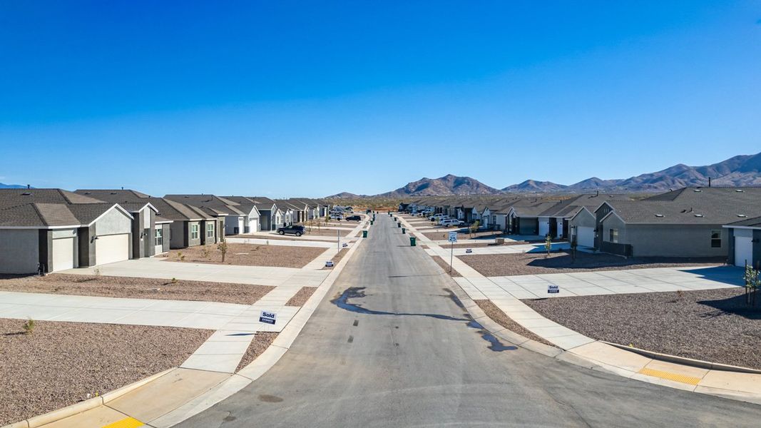 Front exterior of a new home in Sycamore Vista, Vail, AZ, highlighting curb appeal (Image 21).