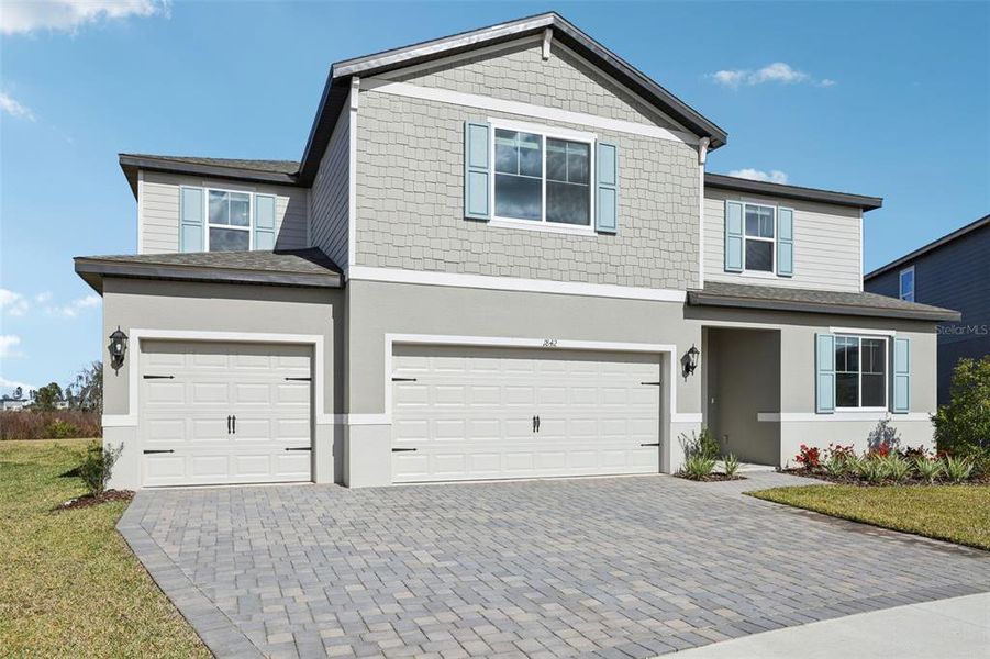 Front exterior of a new home in Two Rivers - Signature Series, Zephyrhills, FL, highlighting curb appeal (Image 27). Front exterior of a new home in Two Rivers - Signature Series, Zephyrhills, FL, highlighting curb appeal (Image 27).