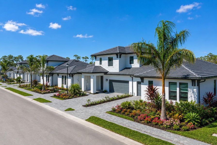 Front exterior of a new home in , Fort Myers, FL, highlighting curb appeal (Image 22). Front exterior of a new home in , Fort Myers, FL, highlighting curb appeal (Image 22).