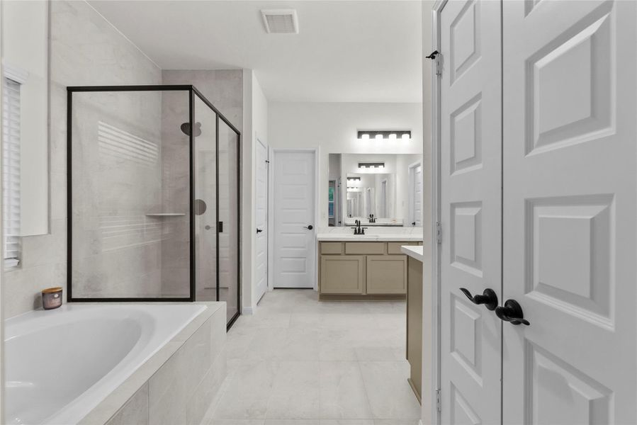 Soak her tub in double vanity sinks in primary suite