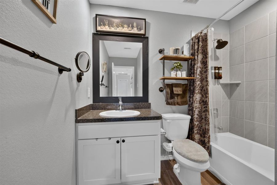 Second full bathroom features a tub and shower combination, vanity with storage and neutral finishes. Second full bathroom features a tub and shower combination, vanity with storage and neutral finishes.