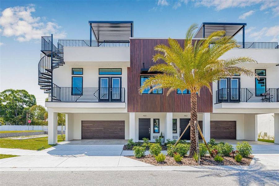 Front exterior of a new home in Terraces at 87th, St. Petersburg, FL, highlighting curb appeal (Image 21). Front exterior of a new home in Terraces at 87th, St. Petersburg, FL, highlighting curb appeal (Image 21).