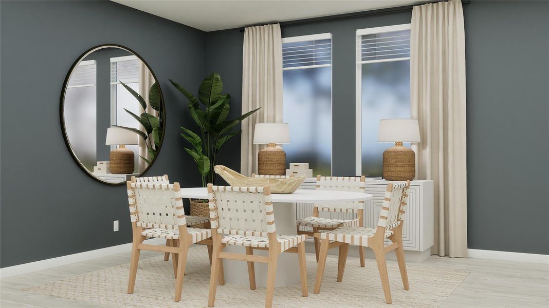 Dining room with light wood-style floors Dining room with light wood-style floors