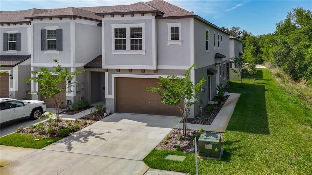 Front exterior of a new home in , Tampa, FL, highlighting curb appeal (Image 23).