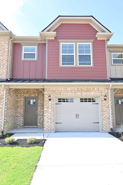 Front exterior of a new home in Talia Trace, Smyrna, TN, highlighting curb appeal (Image 2). Front exterior of a new home in Talia Trace, Smyrna, TN, highlighting curb appeal (Image 2).