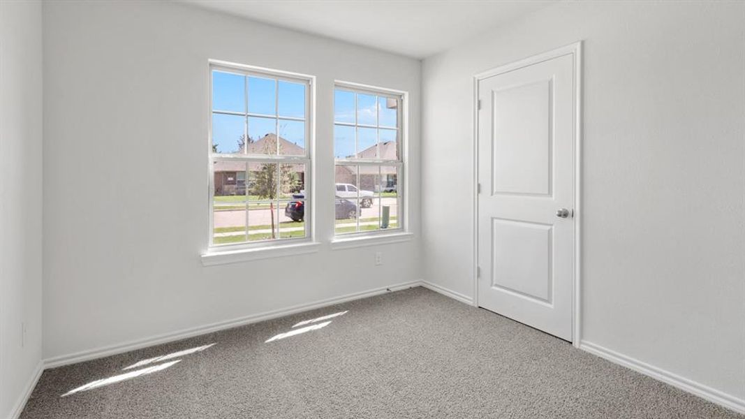 Spare room with carpet flooring and baseboards