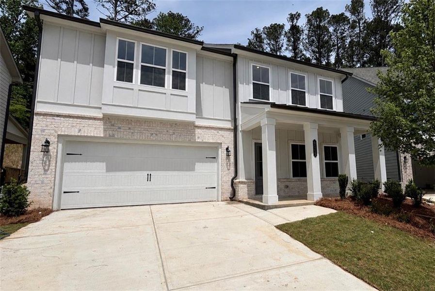 Front exterior of a new home in Arbors at Richland Creek, Buford, GA, highlighting curb appeal (Image 2). Front exterior of a new home in Arbors at Richland Creek, Buford, GA, highlighting curb appeal (Image 2).