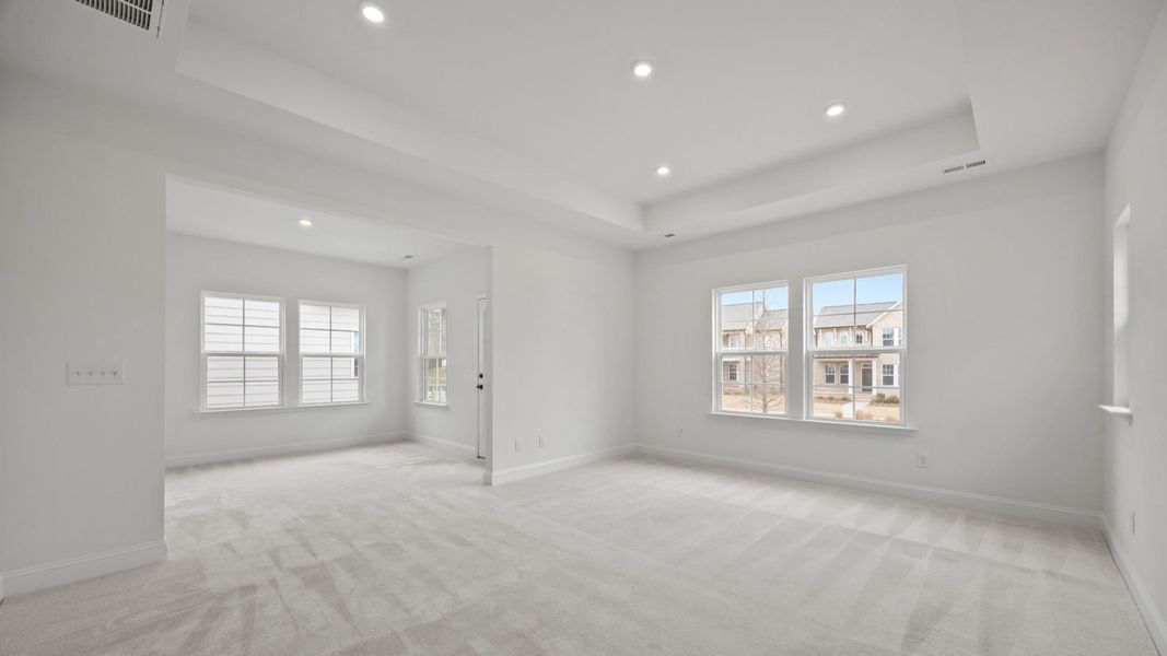 The Brentwood Plan by DRB Homes in River District, Charlotte NC.- Primary Bedroom with Sitting Area The Brentwood Plan by DRB Homes in River District, Charlotte NC.- Primary Bedroom with Sitting Area