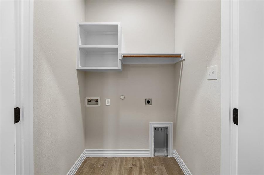 Washroom with washer hookup, hardwood / wood-style flooring, hookup for a gas dryer, and electric dryer hookup