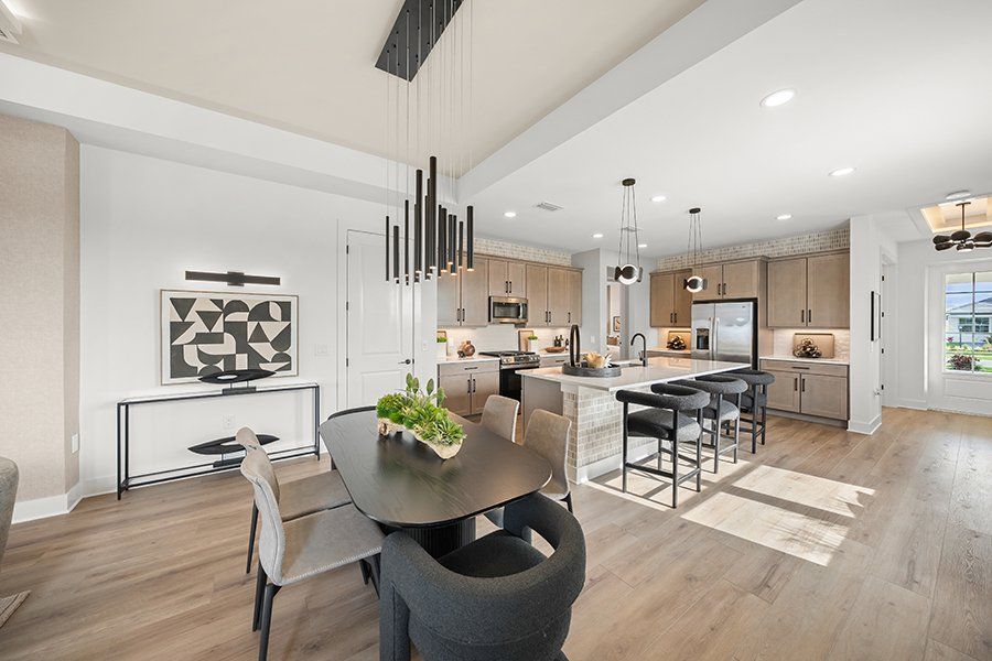 Representative furnished interior of a home built from the Regatta by Homes by Towne in Shellstone at Waterside, Sarasota (Image 9).