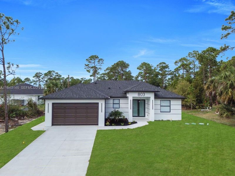 Front exterior of a new home in , Lehigh Acres, FL, highlighting curb appeal (Image 18).