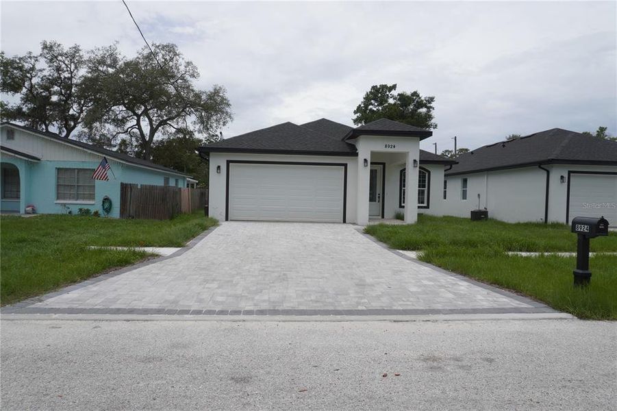 Front exterior of a new home in , Tampa, FL, highlighting curb appeal (Image 27). Front exterior of a new home in , Tampa, FL, highlighting curb appeal (Image 27).