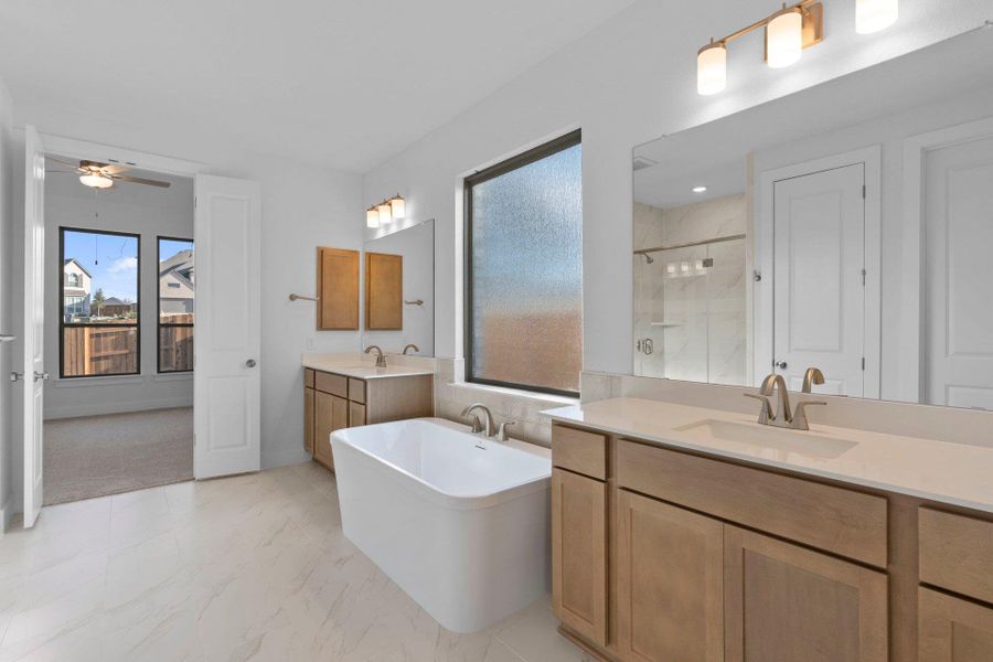 Primary Bath retreat with dual vanities & soaking tub Primary Bath retreat with dual vanities & soaking tub