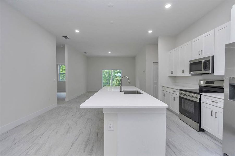 Furnished interior view inside a new home in , Dunnellon (Image 6).