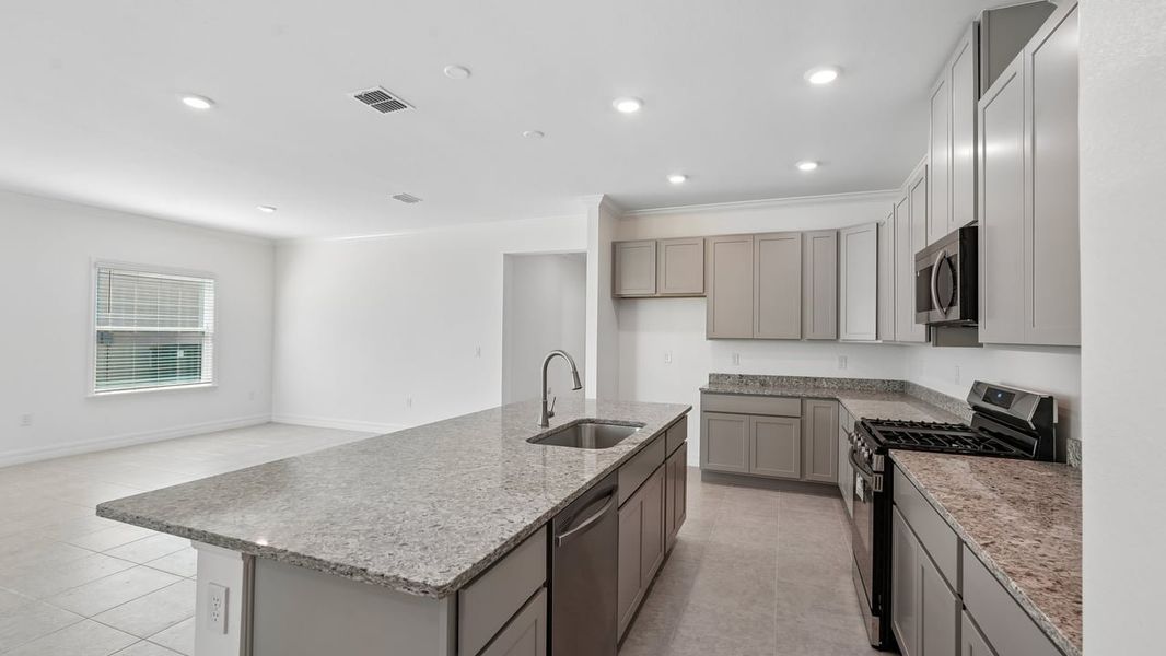 Furnished interior view inside a new home in Heritage Station, Punta Gorda (Image 7).