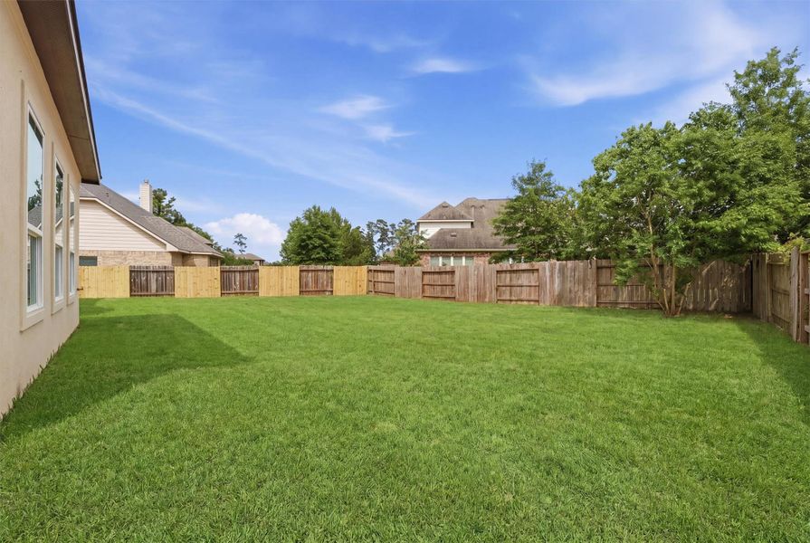 Exterior details and patio area of a home in , Conroe (Image 18).