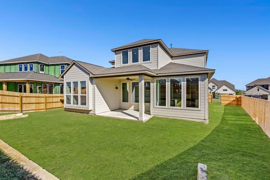 Rear view of house with a ceiling fan, a patio, a fenced backyard, and a shingled roof Rear view of house with a ceiling fan, a patio, a fenced backyard, and a shingled roof